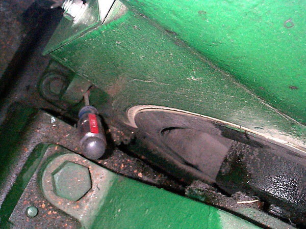 Screwdriver used as shim in machine